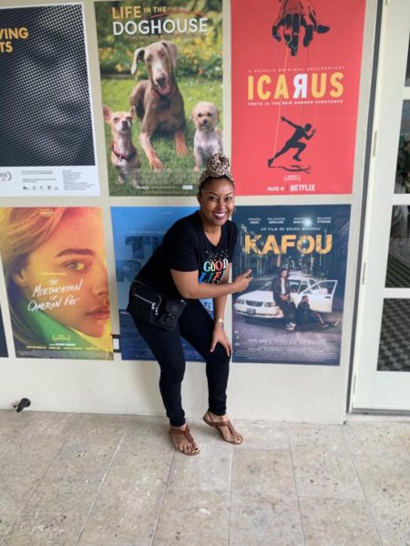 Rogan Smith poses with Kafou film poster