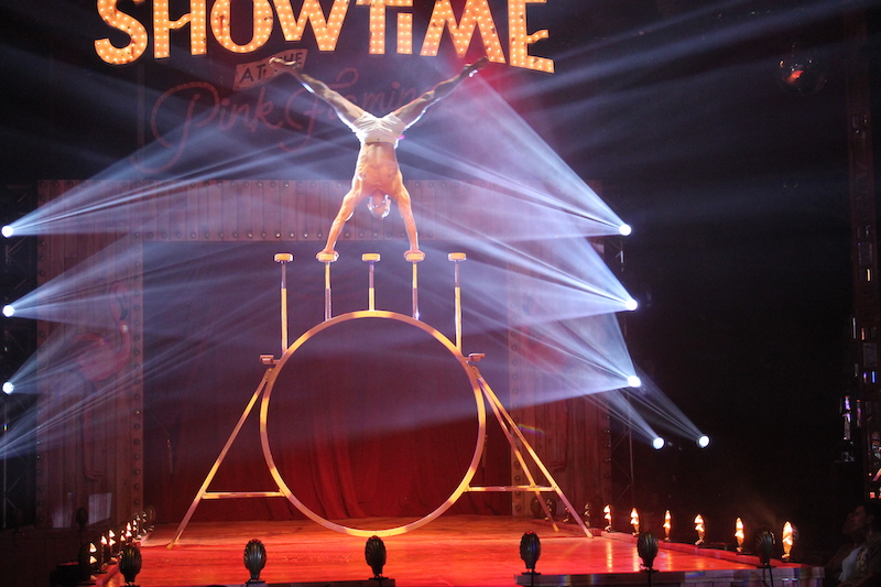 Showtime at the Pink Flamingo. An acrobat shows his strength. (Photo/Rogan Smith)