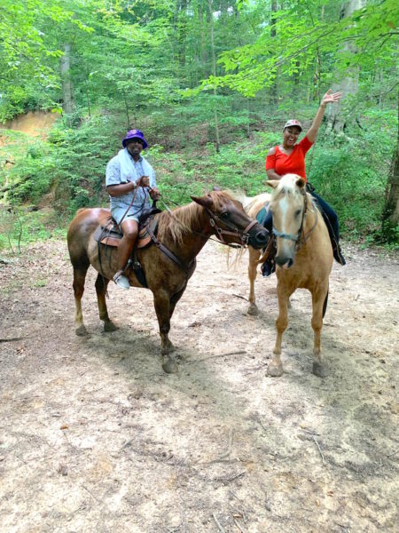 Stopping in the middle of our horseback riding tour for our horses to kiss. 
