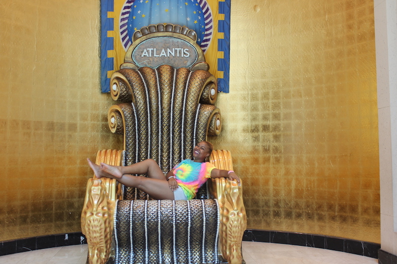 Rogan Smith lounges on the throne in Atlantis. 
