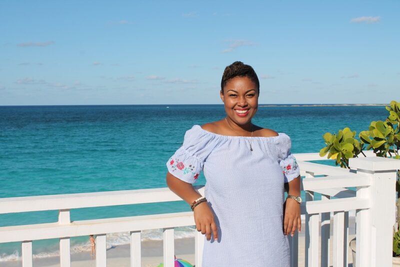This Bahamian Gyal Creative Director, Rogan Smith poses in front of Cabbage Beach on Paradise Island. The beaches in The Bahamas are set to reopen on June 29. 