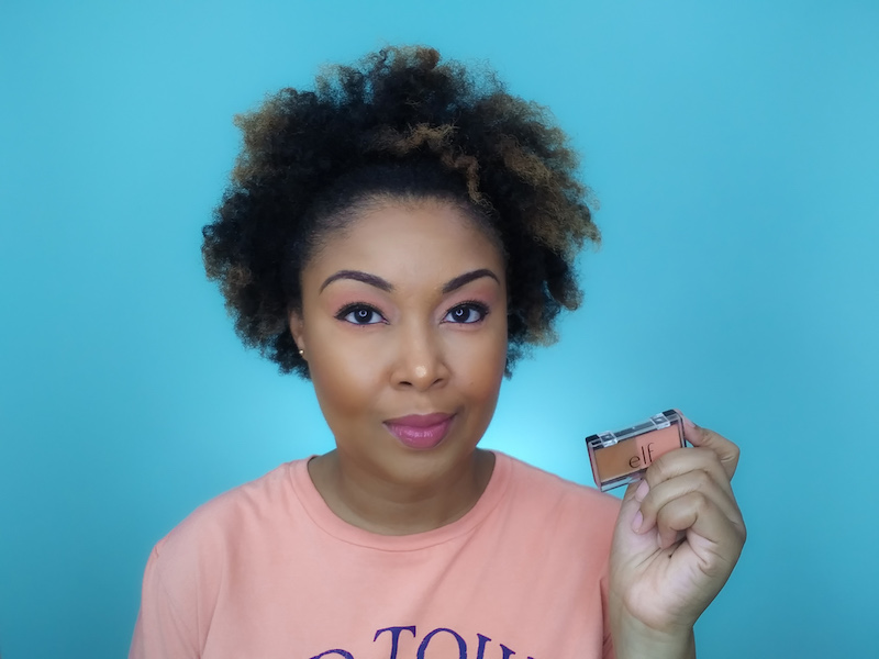 DC-based blogger, Rogan Smith holds the ELF Peach Squad palette in her hand.