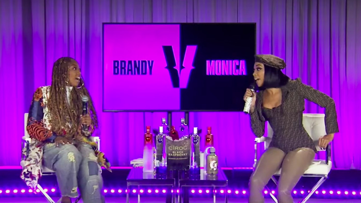 Singers Brandy and Monica sit on the set of their verzuz battle.