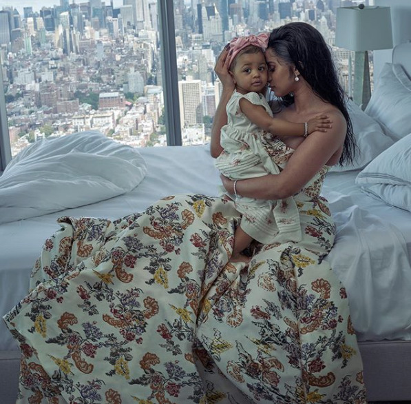 Rapper Cardi B sits on a bed posing with her daughter, Kulture for a magazine shoot. Photo/Cardi B's Instagram