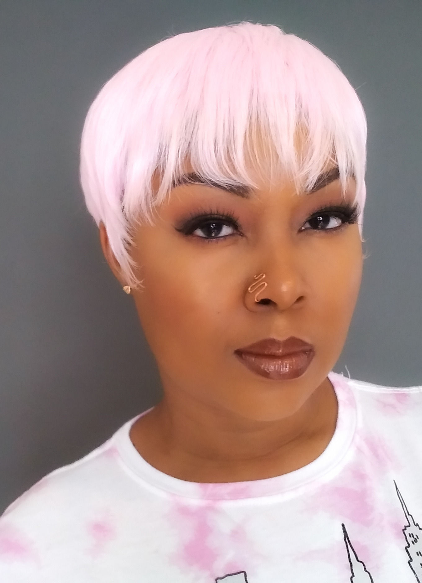 This Bahamian Gyal blogger, Rogan Smith models a pink pixie wig.