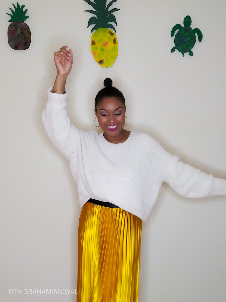 All smiles. Washington, DC blogger and YouTuber, Rogan Smith wears a yellow satin midi skirt. 