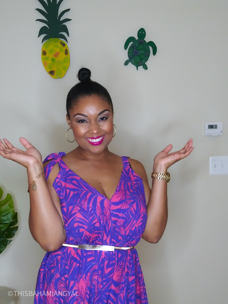 Black beauty blogger, Rogan Smith wears a pink and blue romper.