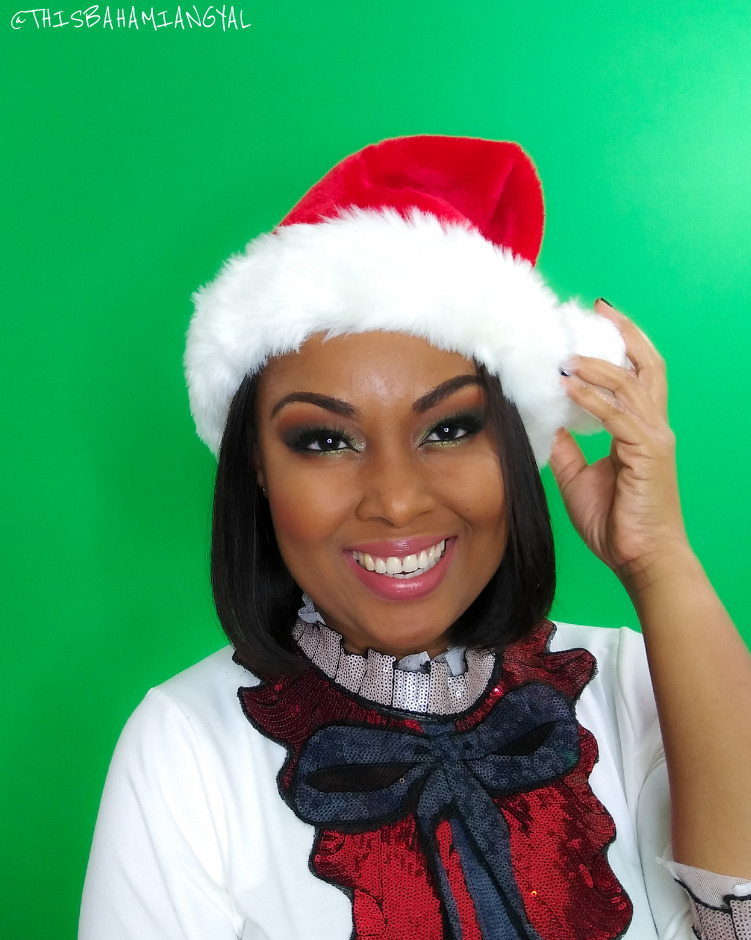Blogger Rogan Smith wears a Santa Claus hat and outfit