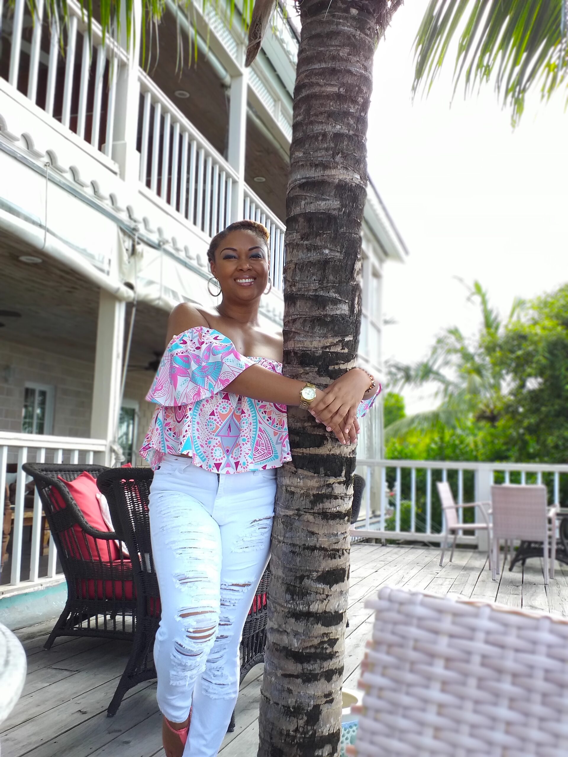 Rogan Smith This Bahamian Gyal black woman hugs tree in Nassau, Bahamas