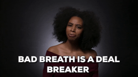 GIF of a black woman talking to the camera and saying bad breath is a deal breaker.