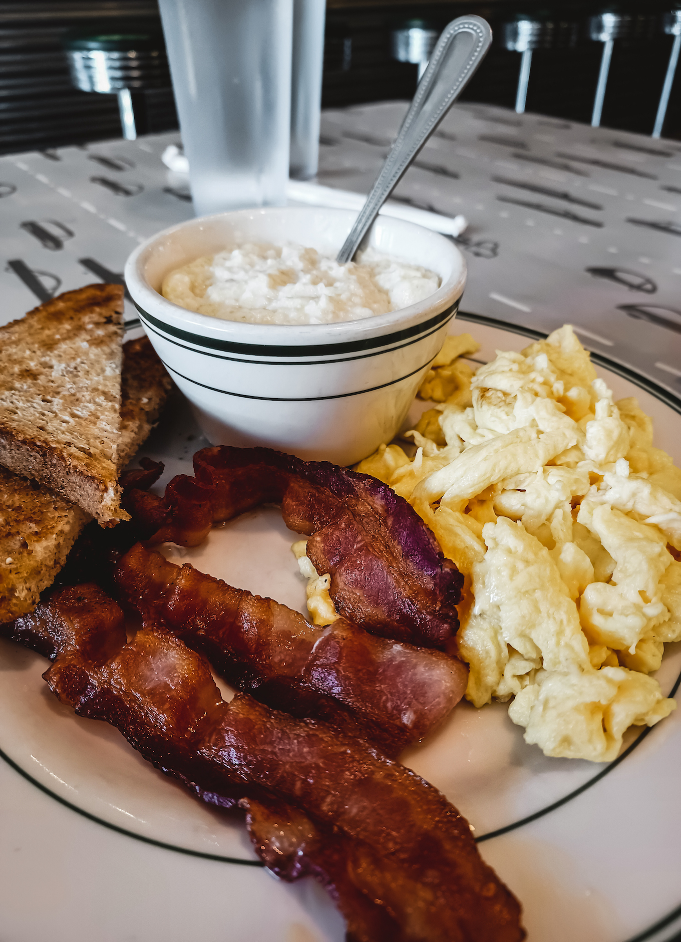 All American breakfast with bacon, eggs and grits