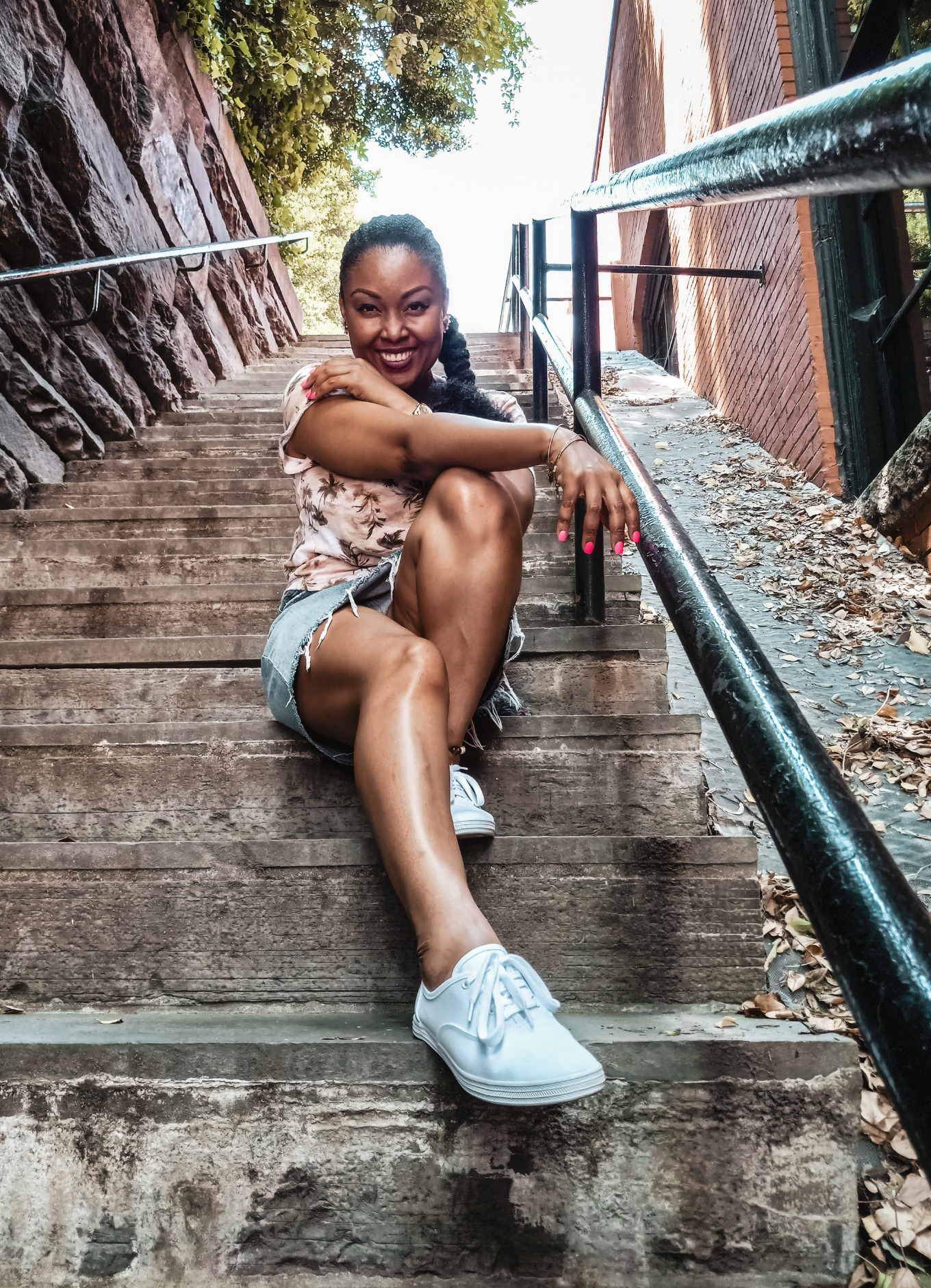 This Bahamian Gyal blogger, Rogan Smith poses on the Exorcist Staircase in Georgetown DC is one of the most beautiful Instagram spots in Washington, DC.