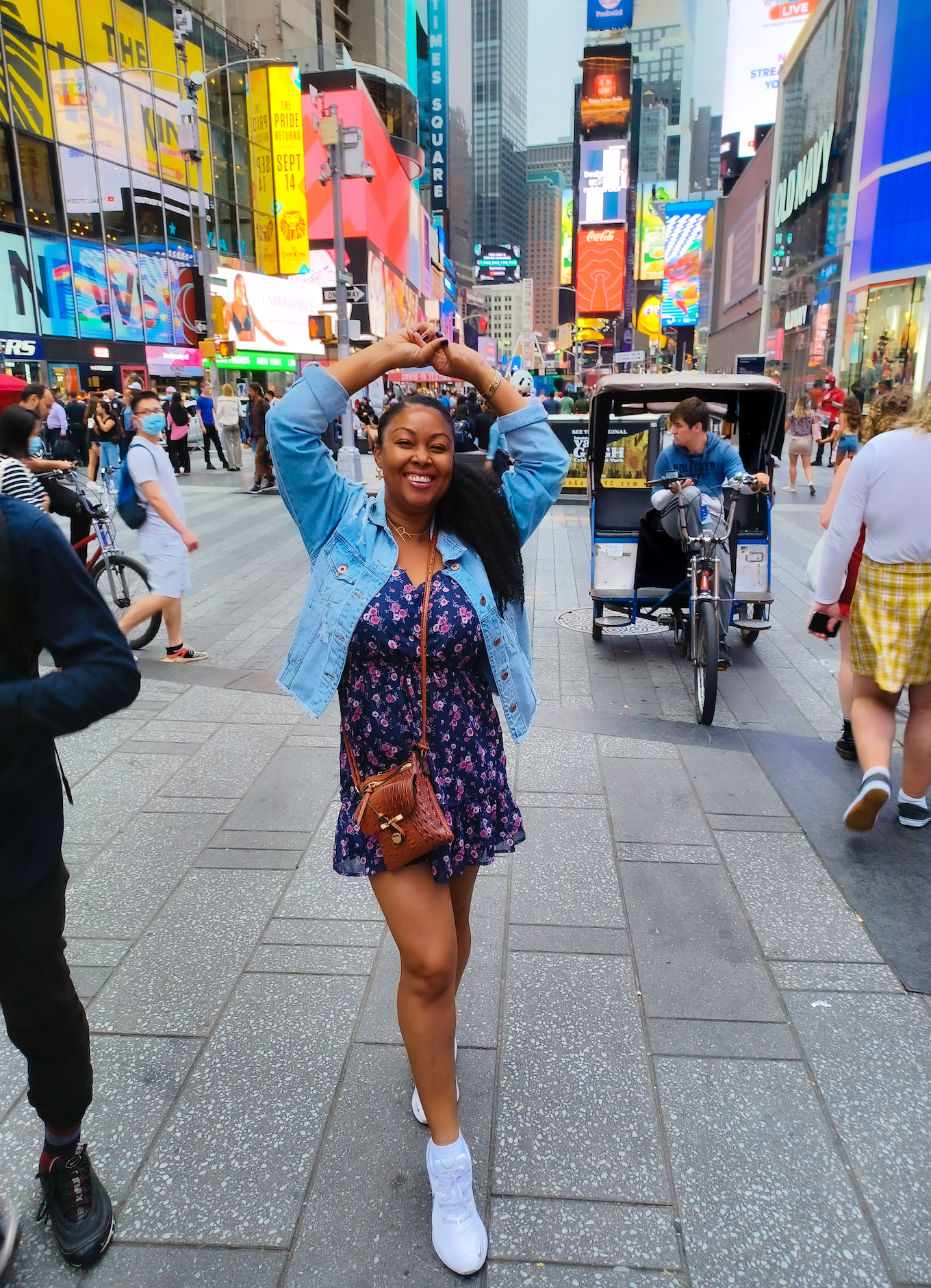 This Bahamian Gyal blogger Rogan Smith smiles in Times Square New York City