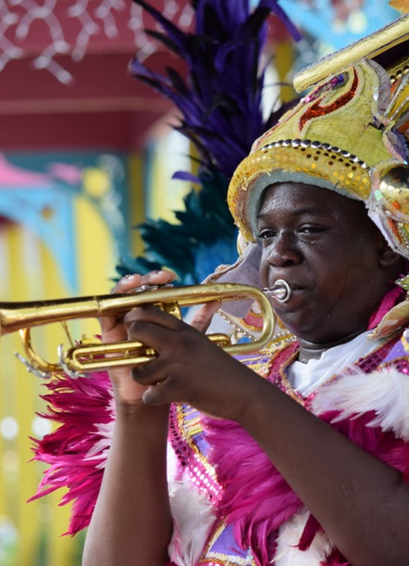 A Junkanooer in The Bahamas blows his horn during a celebration.