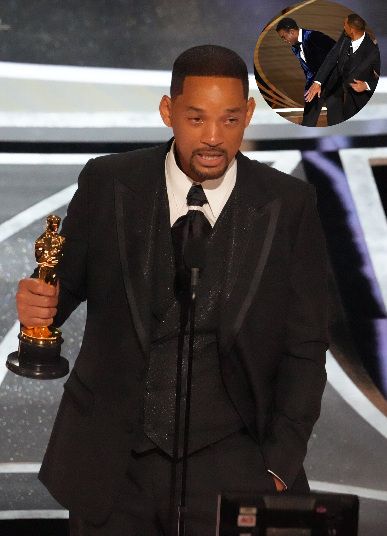 Will Smith stands on stage and accepts his first academy award
