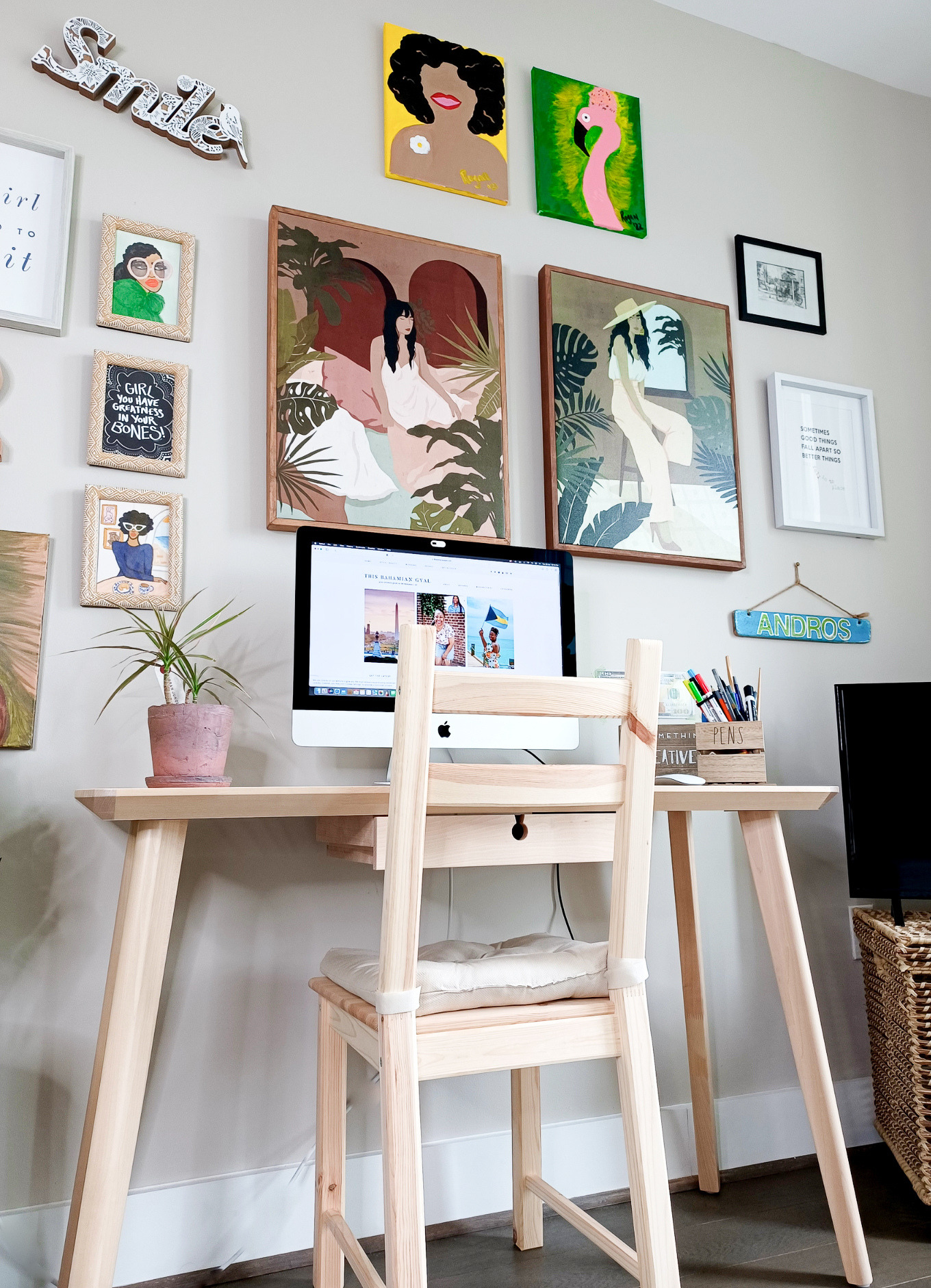 This work from home setup features a gallery wall and an Ikea Lisabo desk.