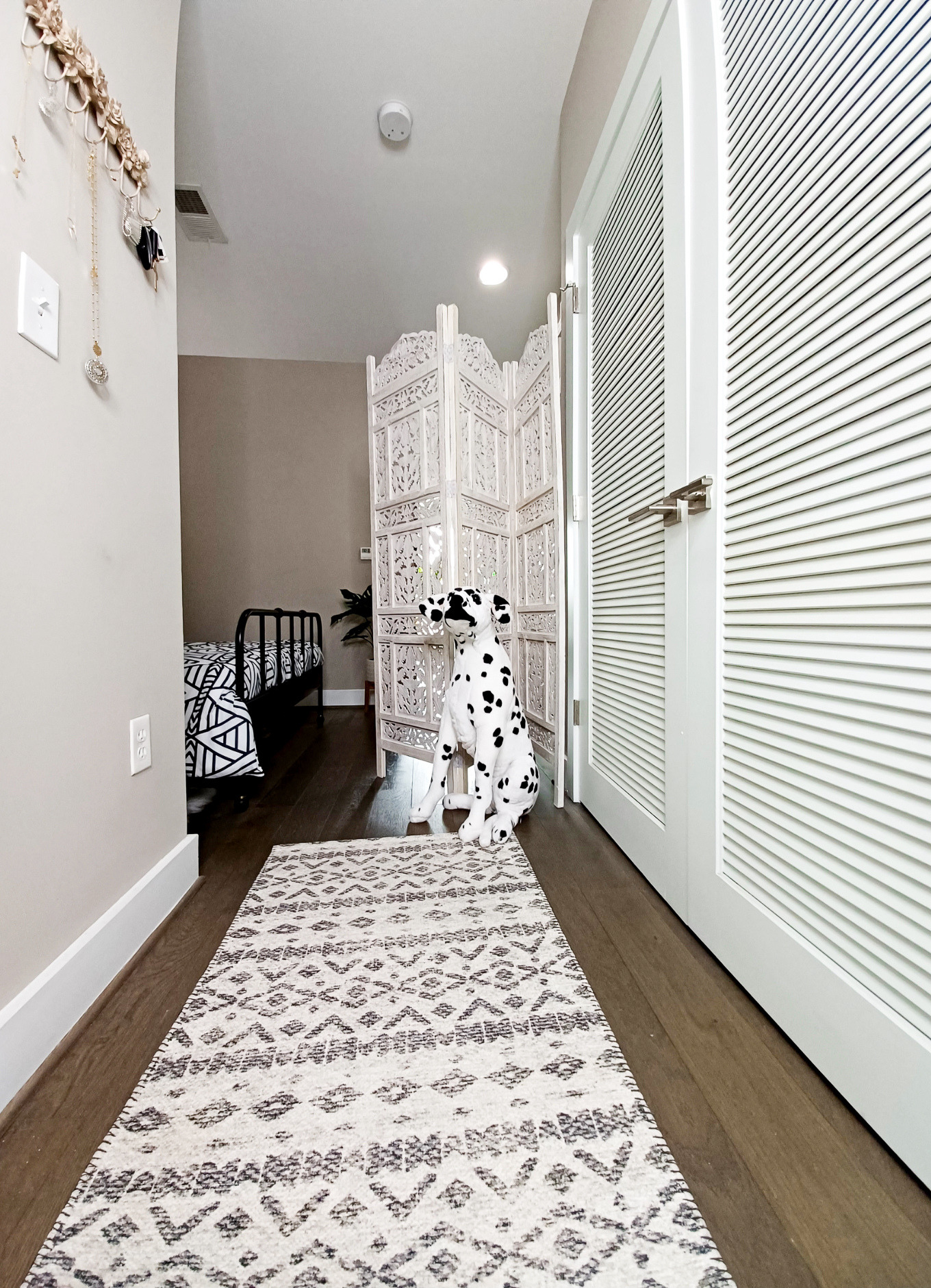 Plush Dalmatian dog sits at the entrance of this Washington, DC apartment