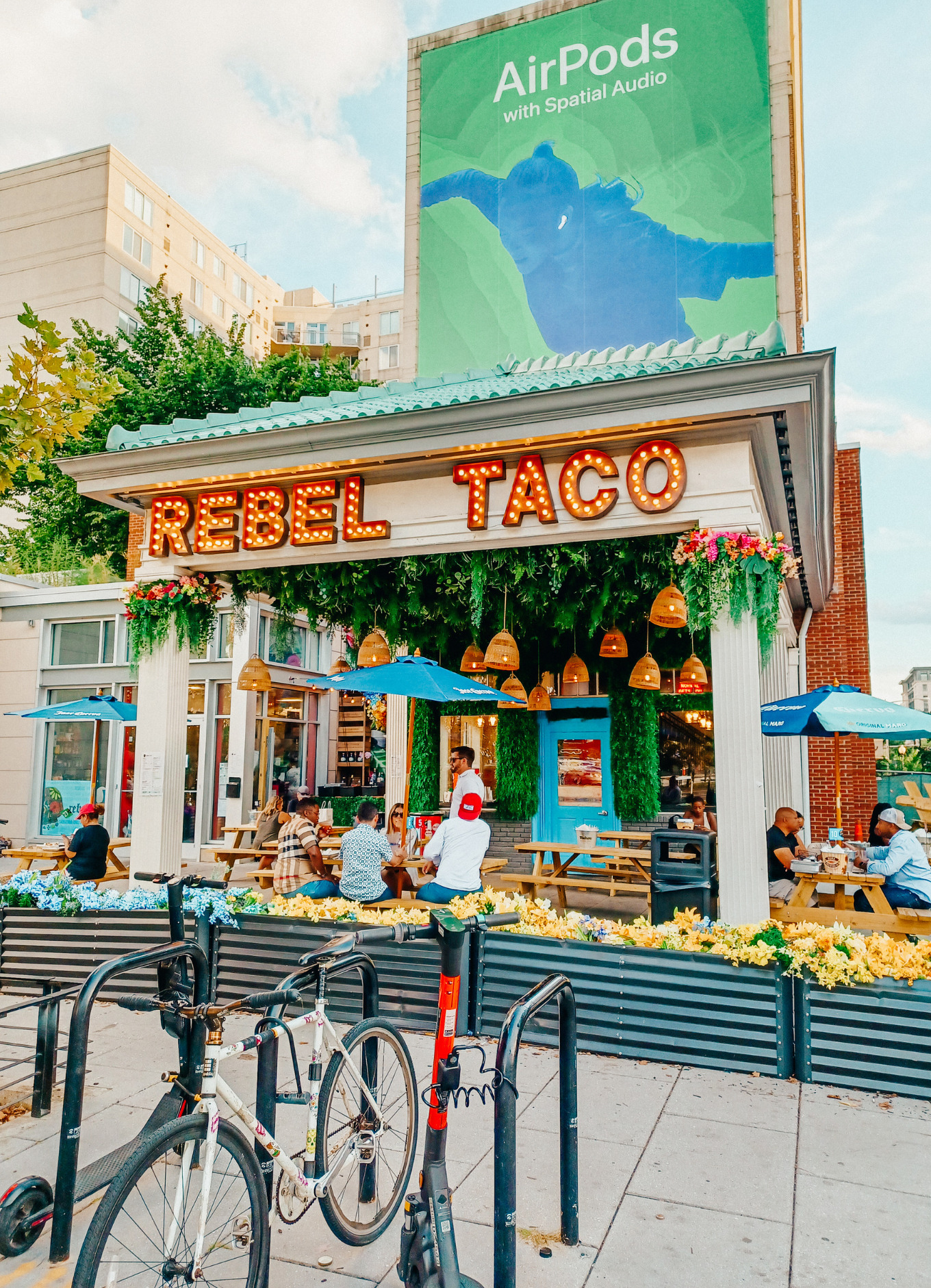 Customers sit outside enjoying a terrific meal at Rebel Taco restaurant in Washington, DC.