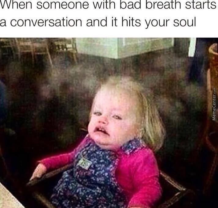 Meme of a white baby girl with her face made up as she smells bad breath.