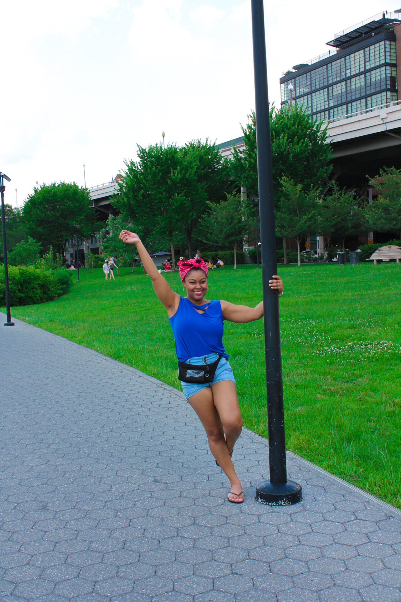 DC blogger, Rogan Smith of This Bahamian Gyal, swings on a pole in Georgetown, DC.