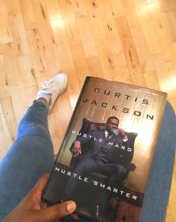 This Bahamian Gyal blogger, Rogan Smith holds a copy of Curtis "50 Cent" Jackson's book, Hustle Harder, Hustle Smarter in her hand.