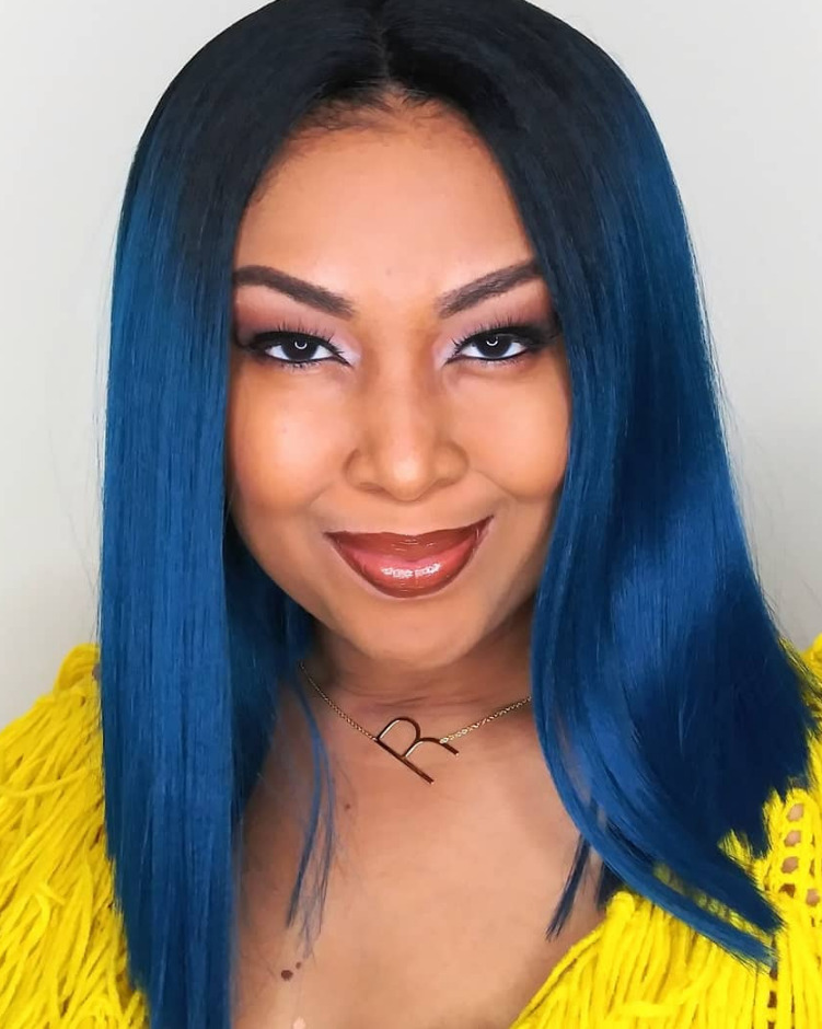 This Bahamian Gyal blogger, Rogan Smith wears a blue, straight lace front wig with a yellow sweater