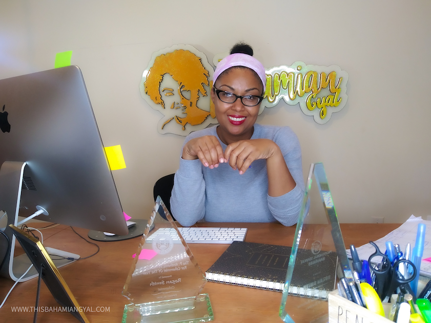 Washington, DC-based blogger, Rogan Smith of This Bahamian Gyal sits at her computer desk blogging. 