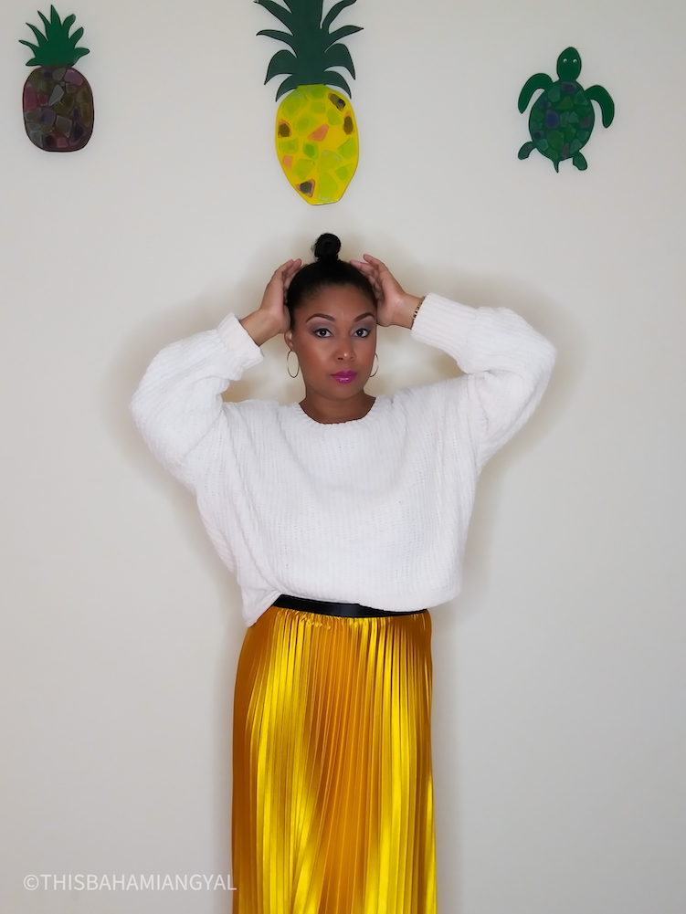 Black Washington, DC blogger, Rogan Smith wears a beautiful mustard coloured midi skirt with a cream coloured sweater from Altar'd State. 
