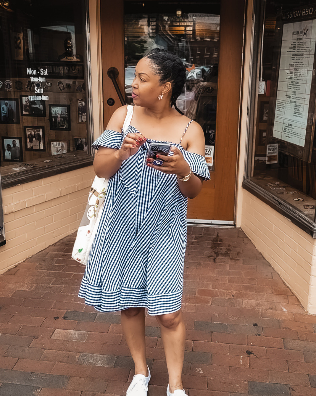 DC blogger Rogan Smith wears a blue and white babydoll dress as she stands in downtown Annapolis in Maryland