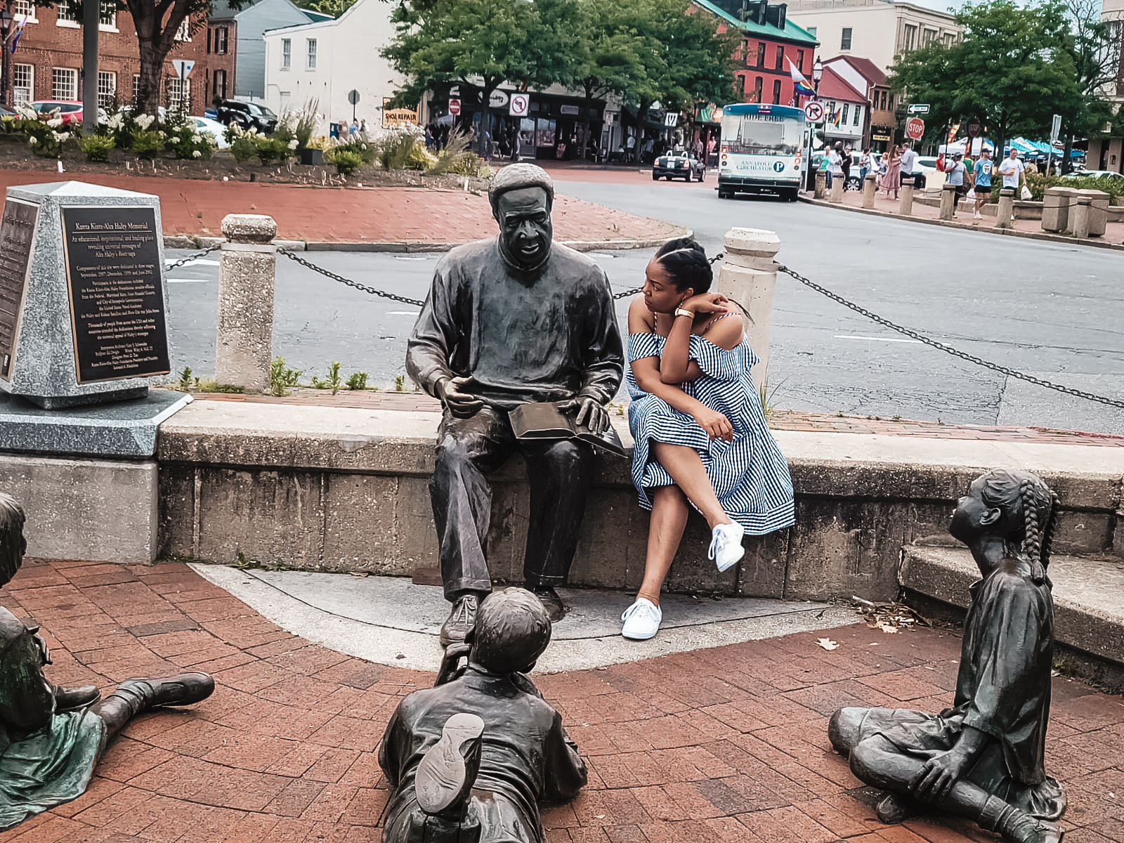 DC blogger Rogan Smith leans in to the Alex Haley - Kunta Kinte monument in Annapolis Maryland