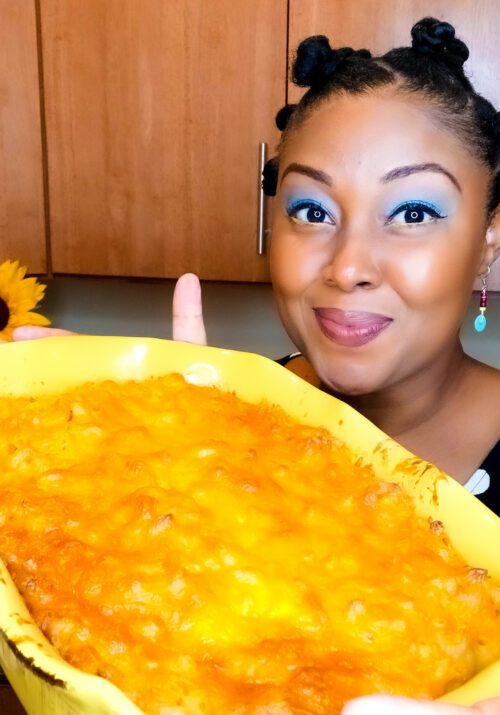 This Bahamian Gyal blogger, Rogan Smith holds a pan of the best Bahamian macaroni recipe ever.