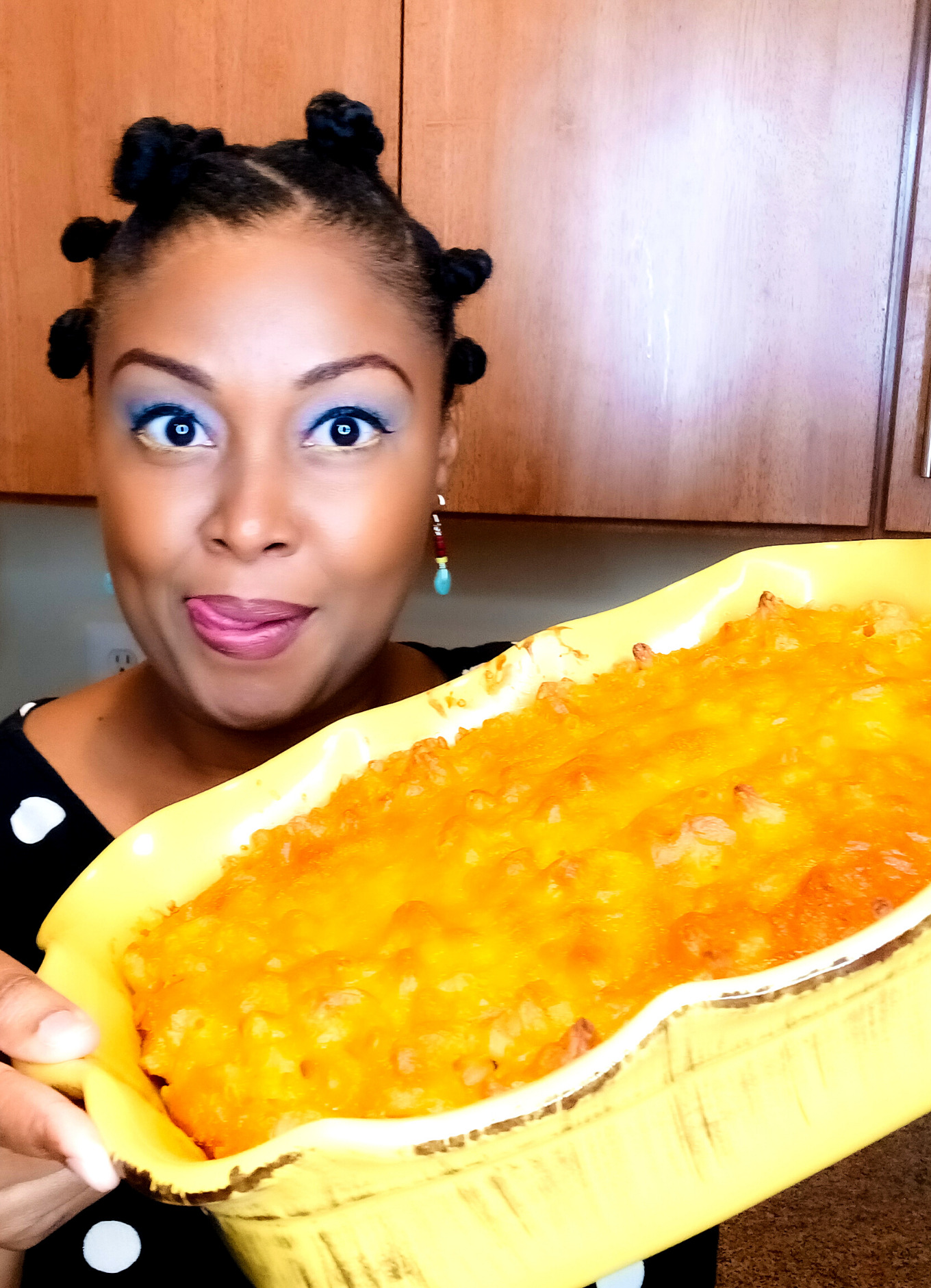 This Bahamian Gyal blogger Rogan Smith holds a pan of Bahamian macaroni and cheese.