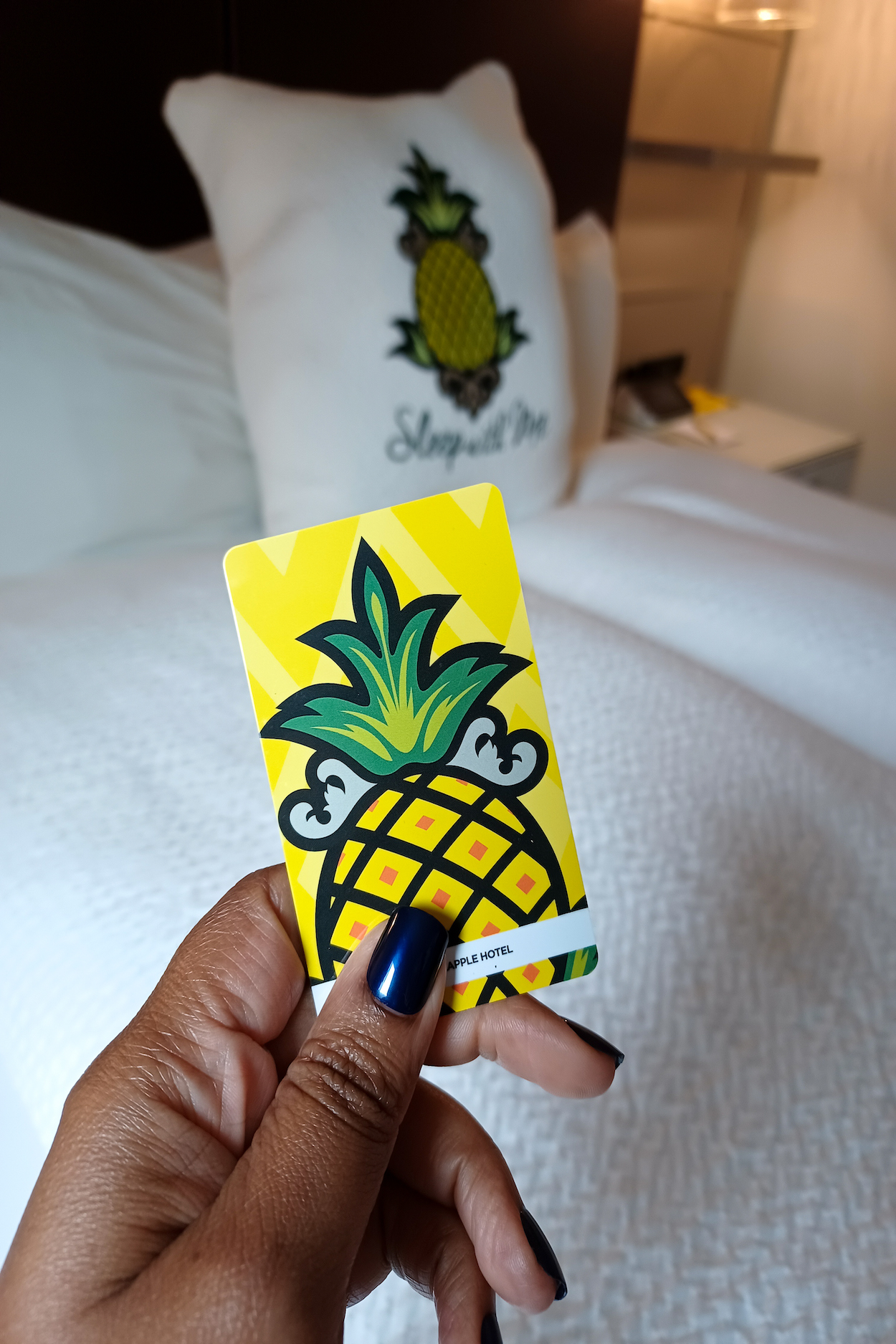 This Bahamian Gyal blogger Rogan Smith holds her StayPineapple room key in her hand