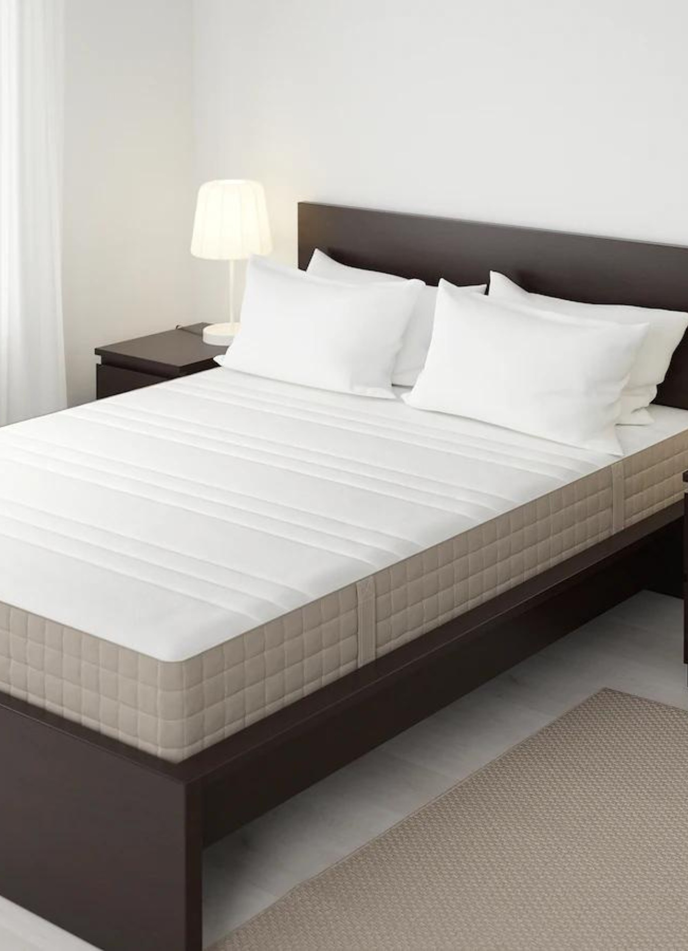 Photo shows bed with an Ikea Haugesund mattress on top