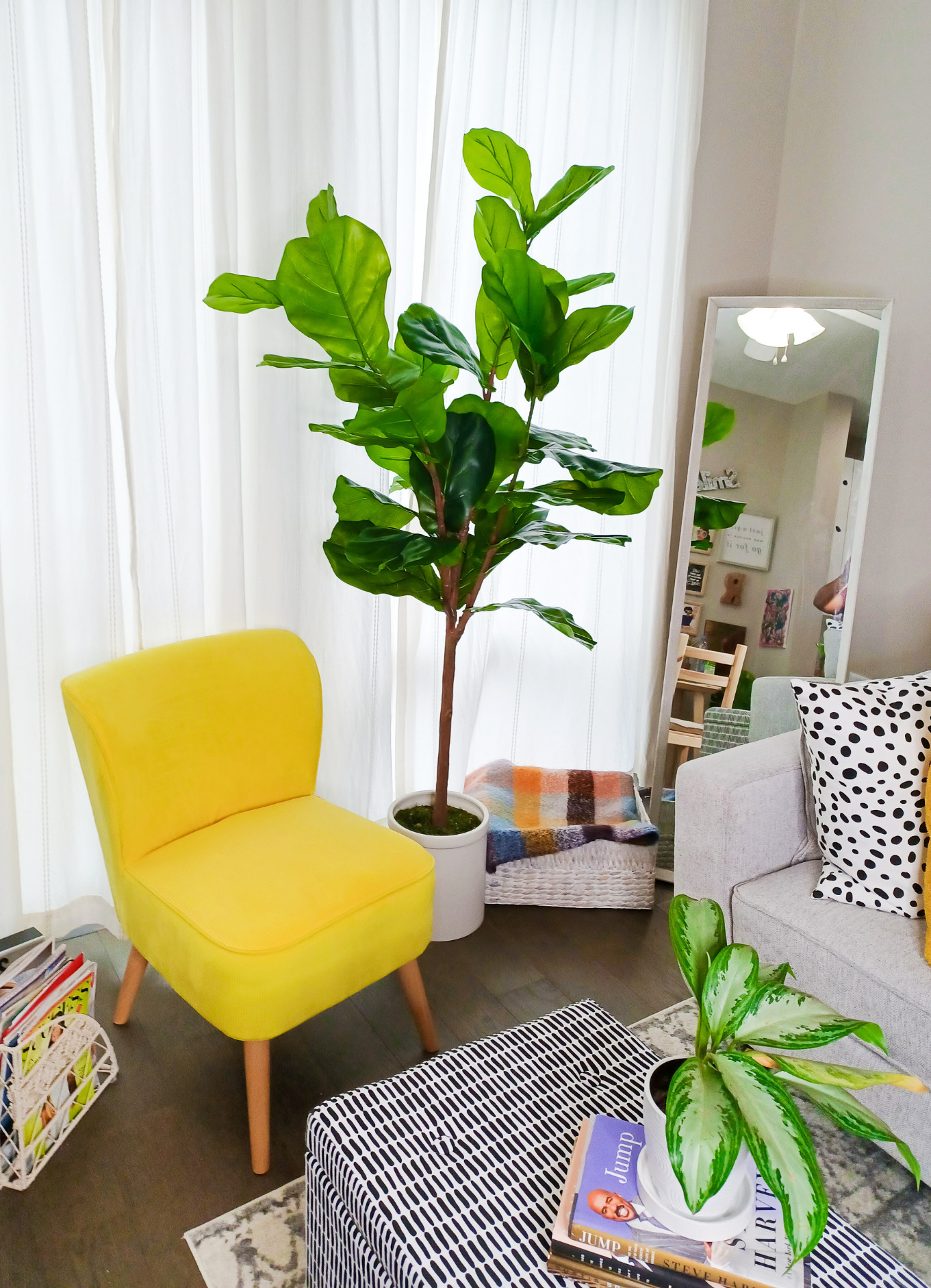 Yellow accent chair from Macy's and a Fiddle leaf tree sits in the corner