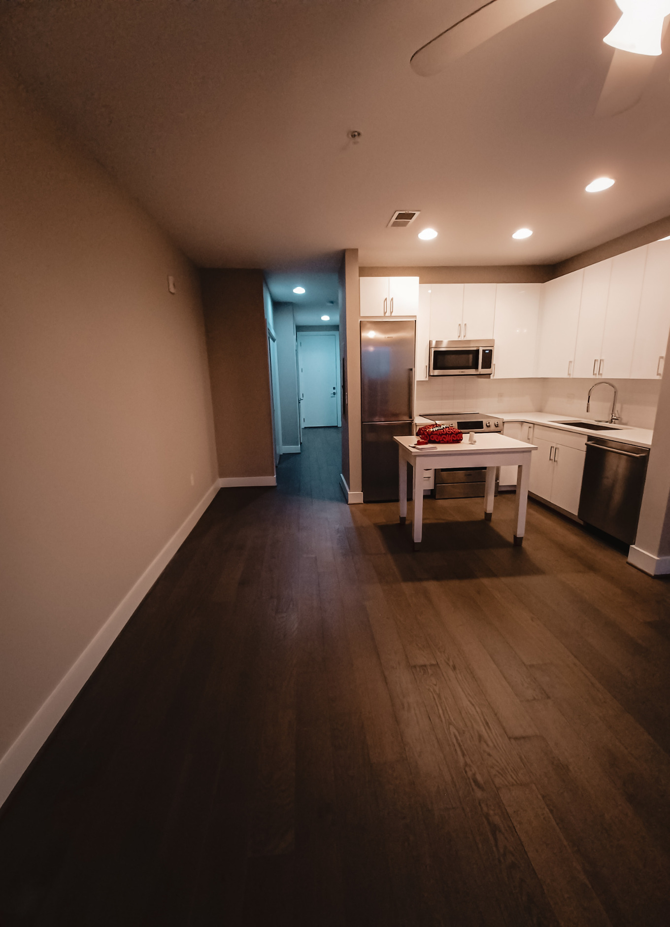 Image of an empty,  dark studio apartment