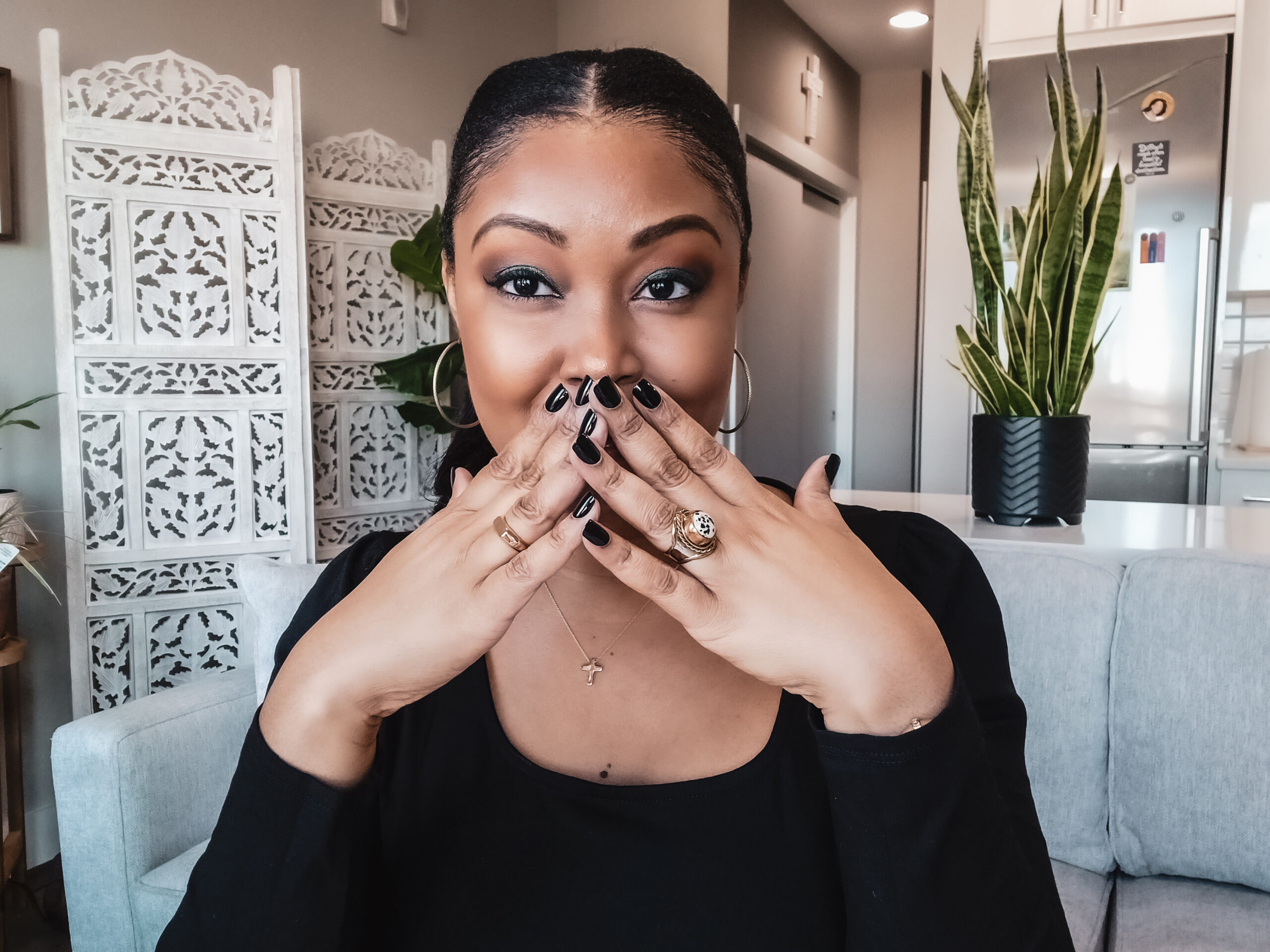 This Bahamian Gyal blogger Rogan covers her mouth in excitement as she shares 8 simple things she did that changed her life entirely