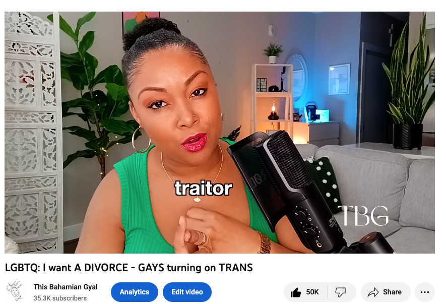 Photo shows This Bahamian Gyal blogger, Rogan in front of a microphone talking about the LGBTQIA+ community. She is wearing a green tank top and has her hair in a bun. 