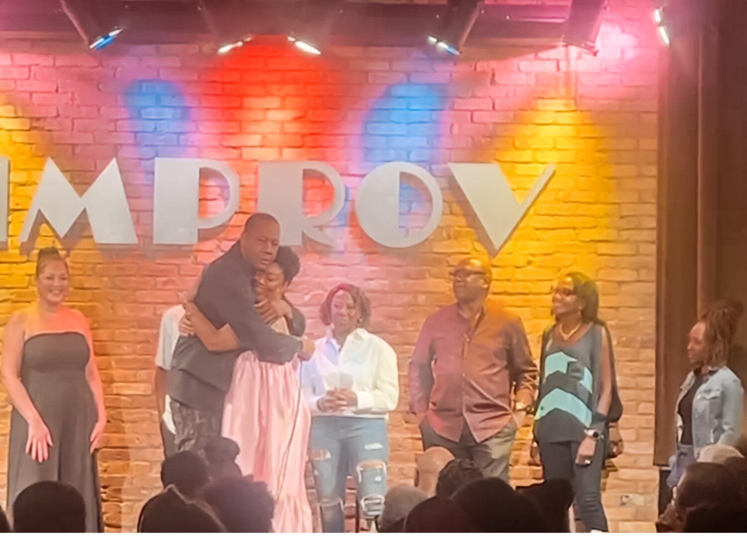 A full embrace between comedian Mark Curry and Blogger_Vlogger Rogan at Dallas Improv in Arlington, Texas on August 29, 2025