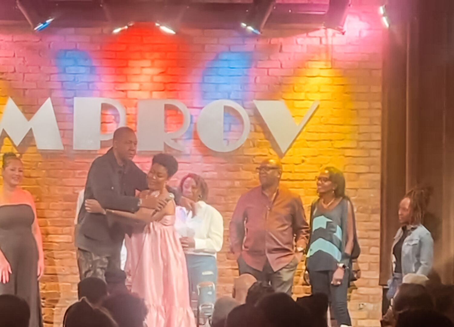 Leaning in for a hug with Mark Curry at Dallas Improv on August 29, 2025