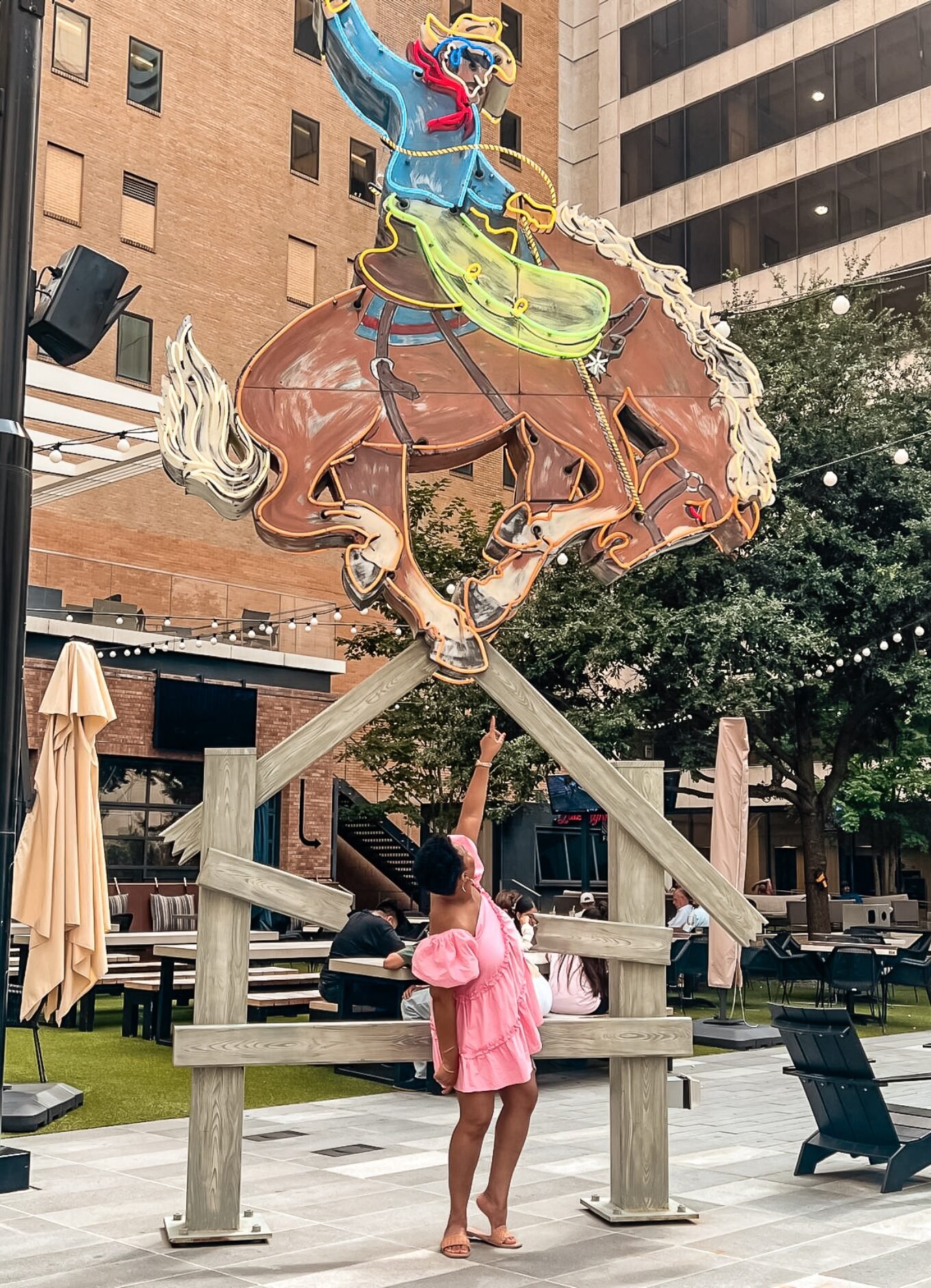 Saddle up, This Bahamian Gyal blogger Rogan poses in Downtown Dallas