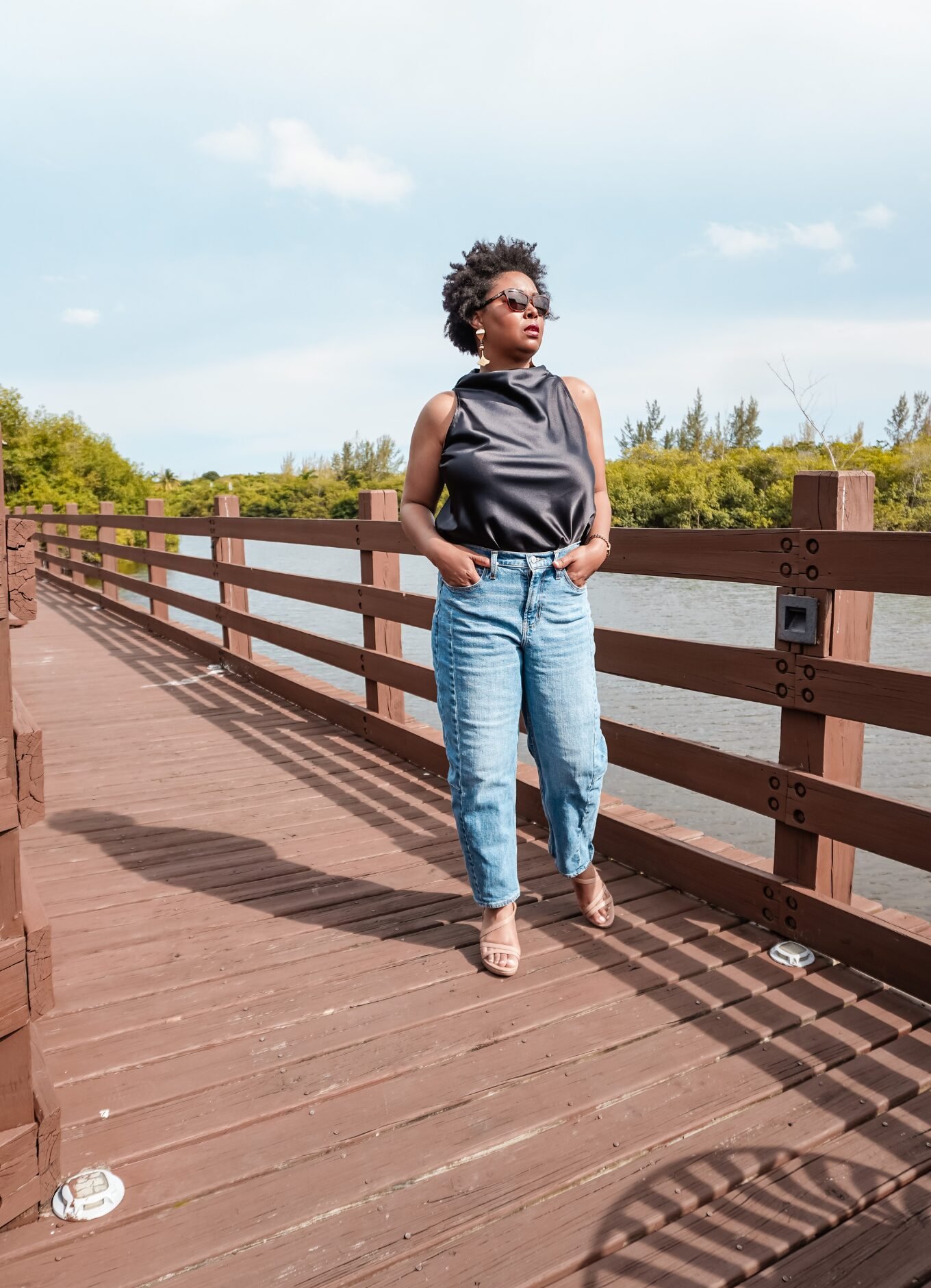 This Bahamian Gyal Blogger, Rogan stands on a bridge in Cable Beach, Bahamas