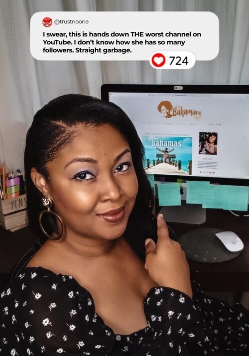 This Bahamian Gyal blogger, Rogan Smith sits in front of computer with blog on computer screen.